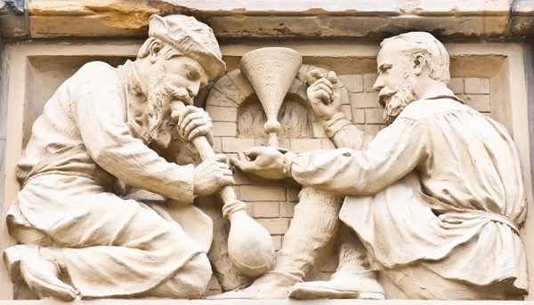 Clay sculpture of two men working glass blowing - Image 2