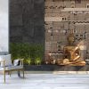 Home decor with a gold statue of Buddha against a black wall with an ethnic pattern of stones - Image 3