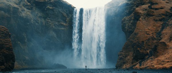 Woman overlooking waterfall at skogafoss, Iceland. Skógafoss, Island. Wallpaper for home - Image 2
